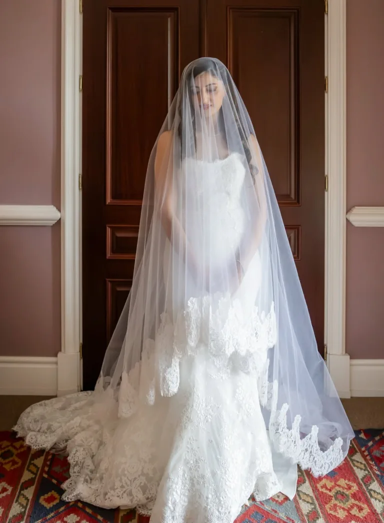 Shirin with her long veil over her face, in the getting-ready room