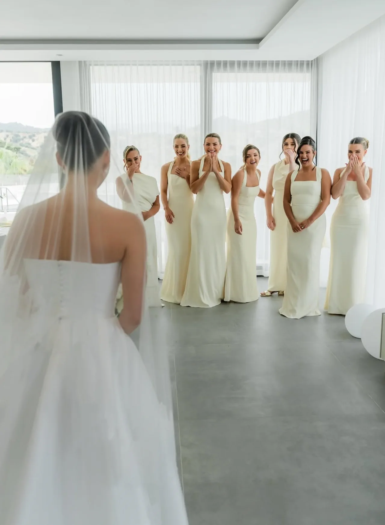 The bridesmaids see the bride for the first time